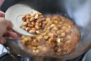 Mapo Tofu with Peanuts step 15: Add the drained tofu cubes and stir-fry until well combined. Add the peeled roas