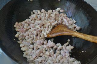 Buckwheat and Pork Stew with Noodles step 6: Heat oil in a pan, add the pork belly and stir-fry until it turns translucent.