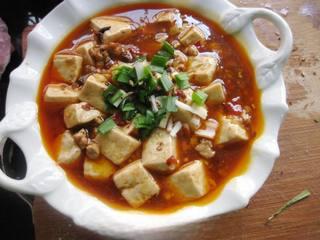 Steamed Tofu with Minced Pork step 15: Garnish with chopped green onions and Sichuan peppercorns before serving.