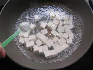 Steamed Tofu with Minced Pork step 2: Once boiling, add half a teaspoon of salt to the water.