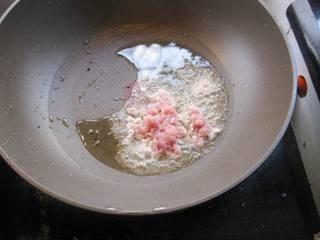 Steamed Tofu with Minced Pork step 8: Fry the marinated pork in the hot oil, stirring to separate the pieces.