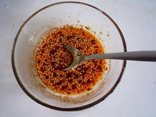 Spicy Chicken Thigh Salad step 5: While cooking the chicken, prepare a dressing by mixing two tablespoons of light