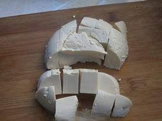 Creamy Milk Recipe step 6: Drain the milk curd and cut it into cubes.
