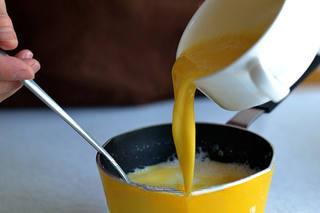 Milk Pudding with Caramel Sauce step 2: Add eggs to the mixture and stir well until combined.