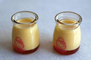 Milk Pudding with Caramel Sauce step 7: Pour the strained pudding mixture into the prepared molds. Preheat oven to 160°C