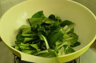 Cabbage and Tofu Soup step 5: Add bok choy and stir-fry until slightly softened.