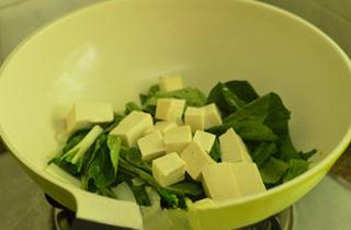 Cabbage and Tofu Soup step 6: Add the tofu and continue to cook.