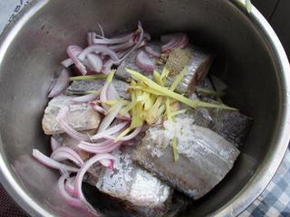 Braised Cod with Tomato Sauce step 2: Add sliced onions, ginger, garlic, salt, and pepper to taste.